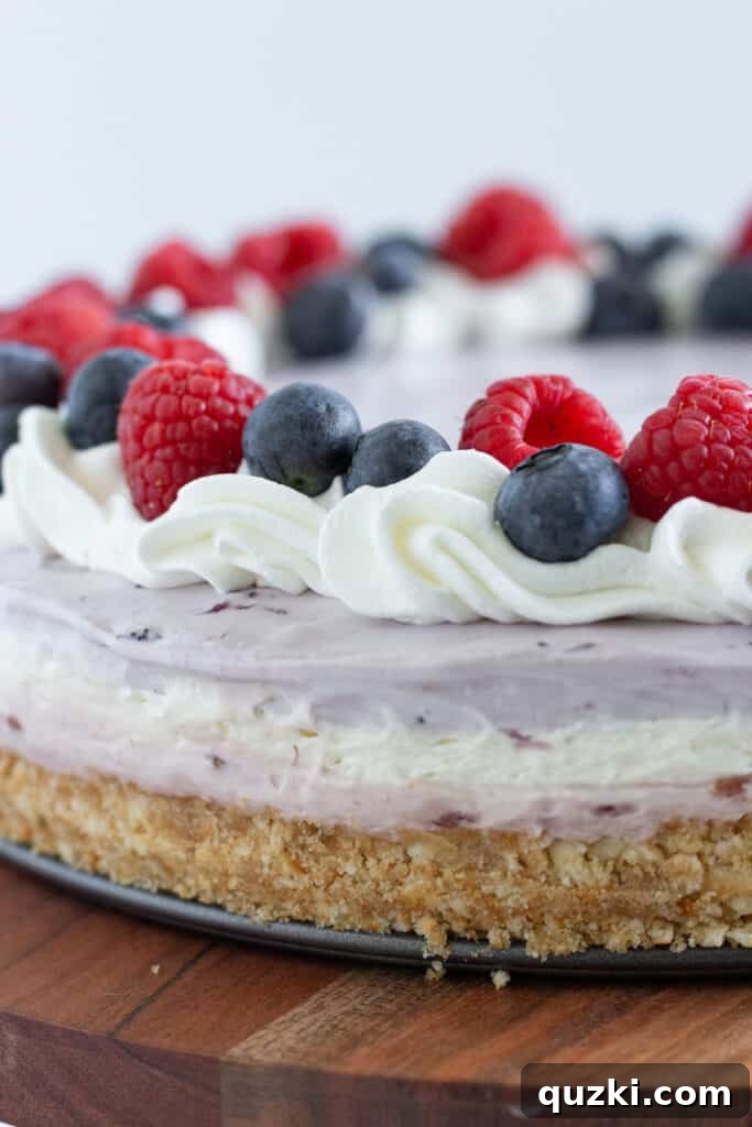 Berry No-Bake Cheesecake featuring patriotic red, white, and blue layers, a refreshing summer dessert