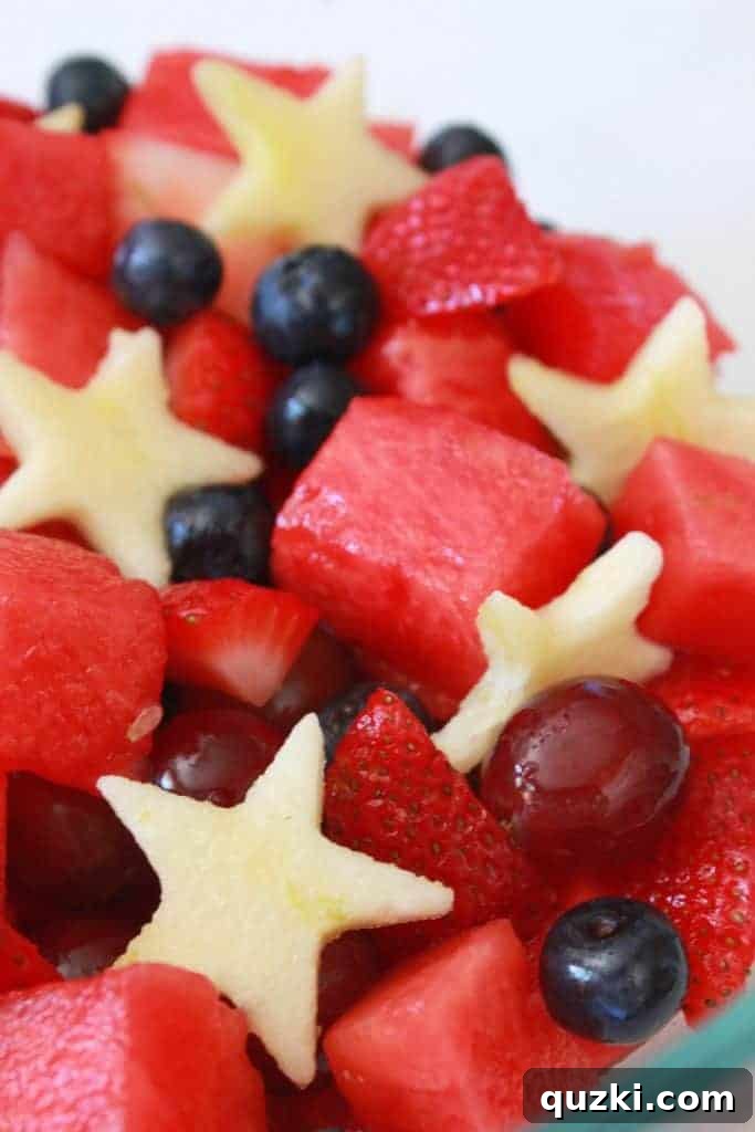 Red White and Blue Fruit Salad for the 4th of July, with lime simple syrup and apple stars, a healthy patriotic dessert