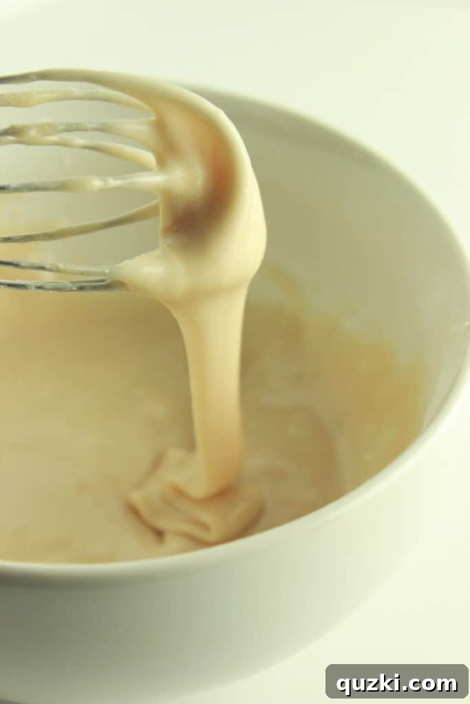 Maple Pecan Bliss Scones 11 Mixing powdered sugar, maple syrup, and milk to create the maple glaze.