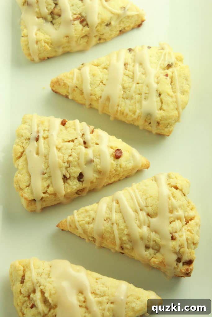 Maple Pecan Bliss Scones 13 A plate of perfectly glazed Maple Pecan Scones, ready to be enjoyed.