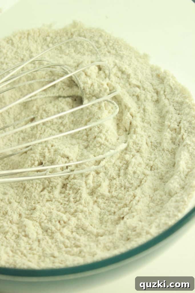 Maple Pecan Bliss Scones 3 Mixing flour, brown sugar, salt, and baking powder for scone dough.