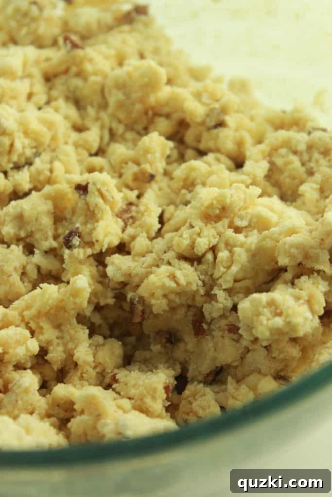 Maple Pecan Bliss Scones 7 Mixing wet and dry ingredients with a fork to form scone dough.