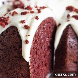 Serving a slice of red velvet bundt cake.