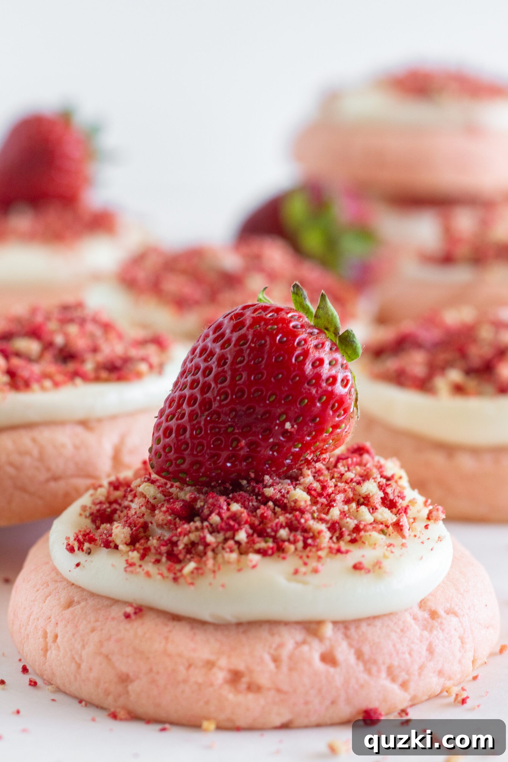 Strawberry Crumble Cookie Craze 3 Close-up of Easy Strawberry Crunch Cookies, showcasing the texture of the soft cookie, creamy frosting, and vibrant crunch.