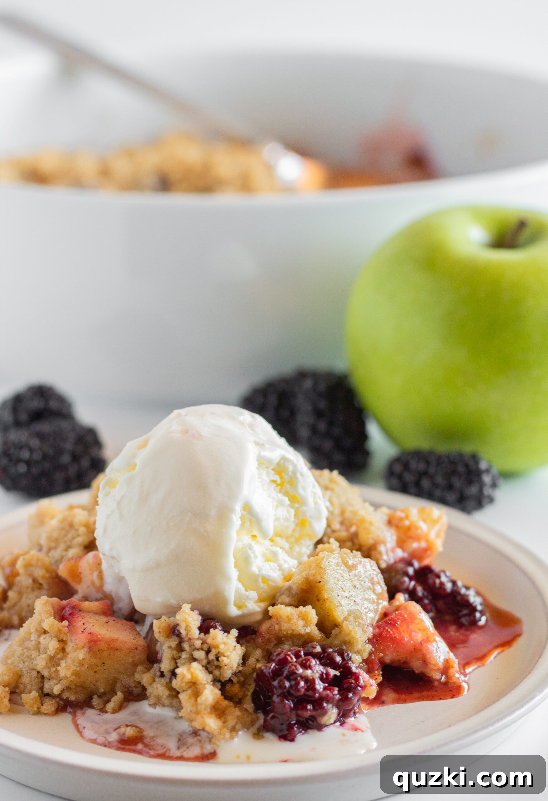 Sweet Tangy Apple Blackberry Crumble 3 Close-up of freshly baked Apple and Blackberry Crumble, showing the golden brown topping and bubbling fruit filling.