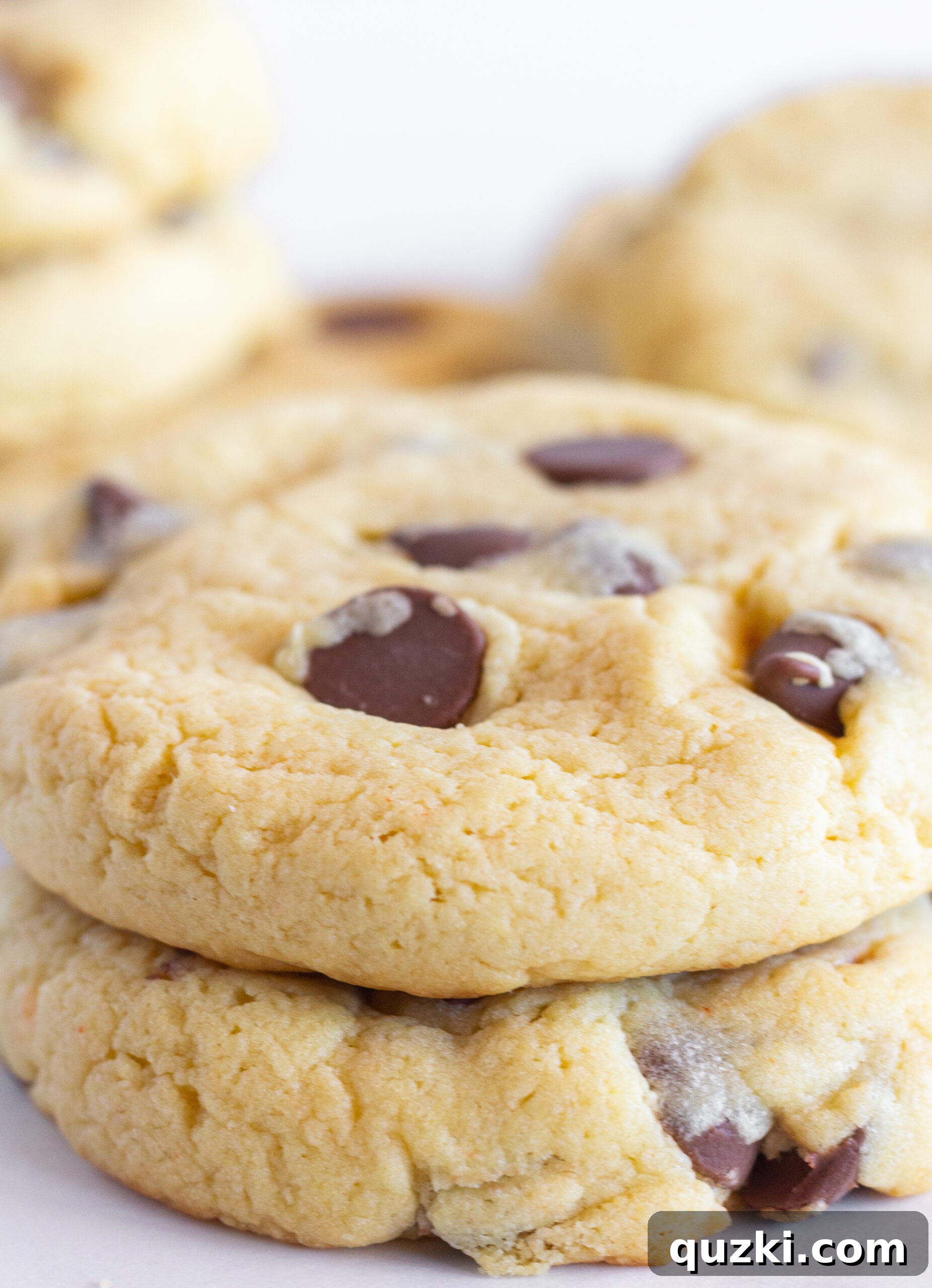 A plate of freshly baked Easy Chocolate Chip Cake Mix Cookies, showcasing their golden edges and melty chocolate