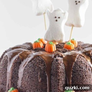 A Halloween Bundt Cake with ghosts and pumpkins.