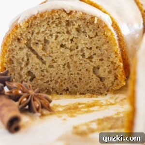 Looking at the middle of a spice bundt cake, showcasing its texture and glaze.