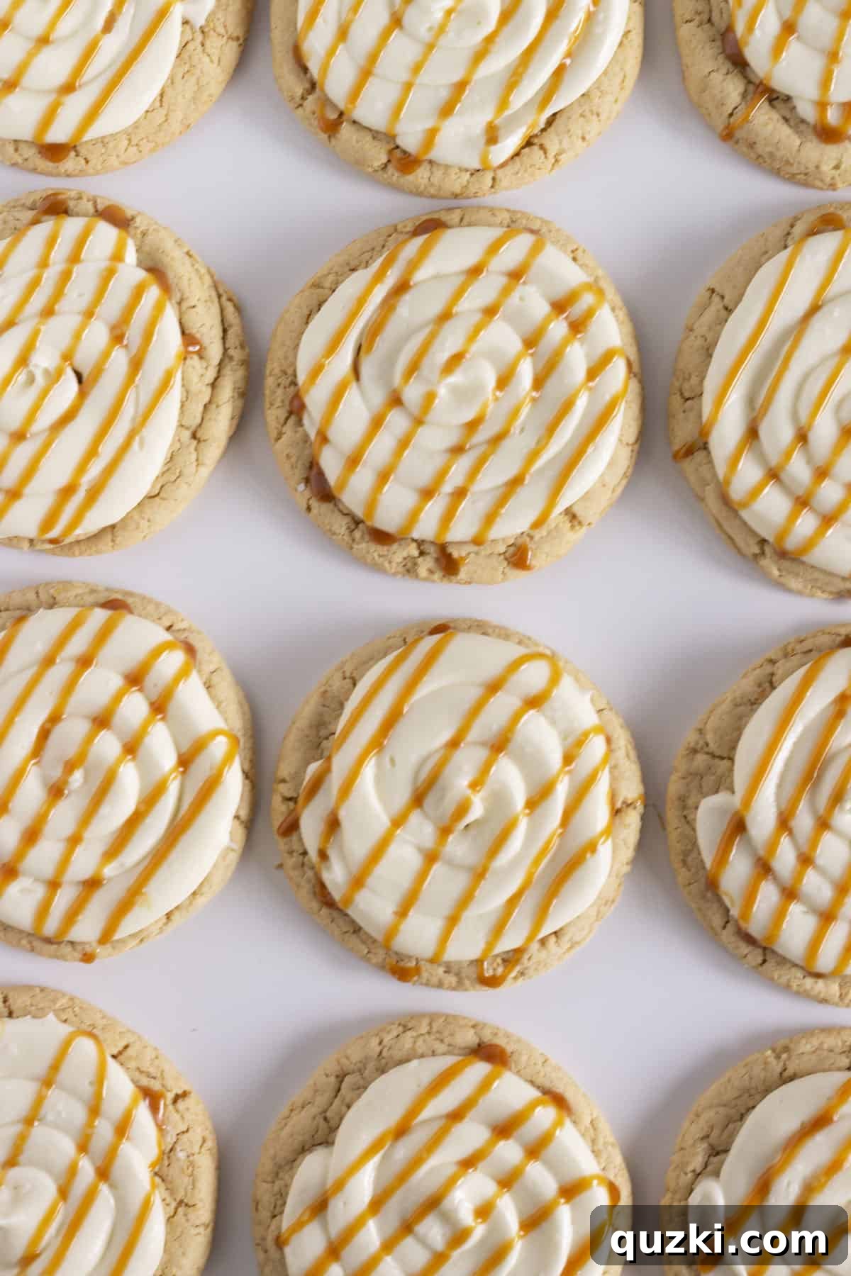 20 Festive Cake Mix Cookies Made Easy 11 Irresistible Salted Caramel Cheesecake Cookies, elegantly arranged on a pristine white tray, showcasing their creamy topping and caramel drizzle.