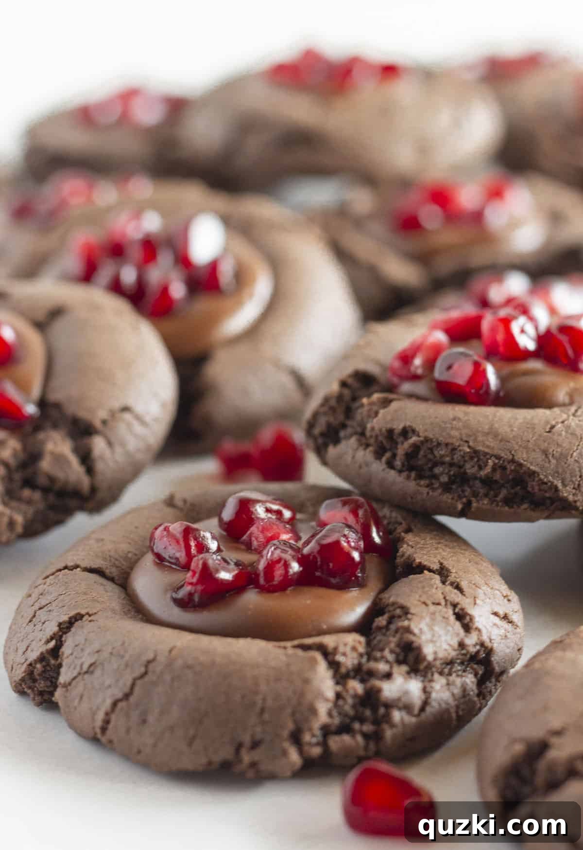 20 Festive Cake Mix Cookies Made Easy 18 Decadent chocolate cookies topped with a rich chocolate ganache and adorned with glistening pomegranate seeds, creating a visually stunning and delicious treat.