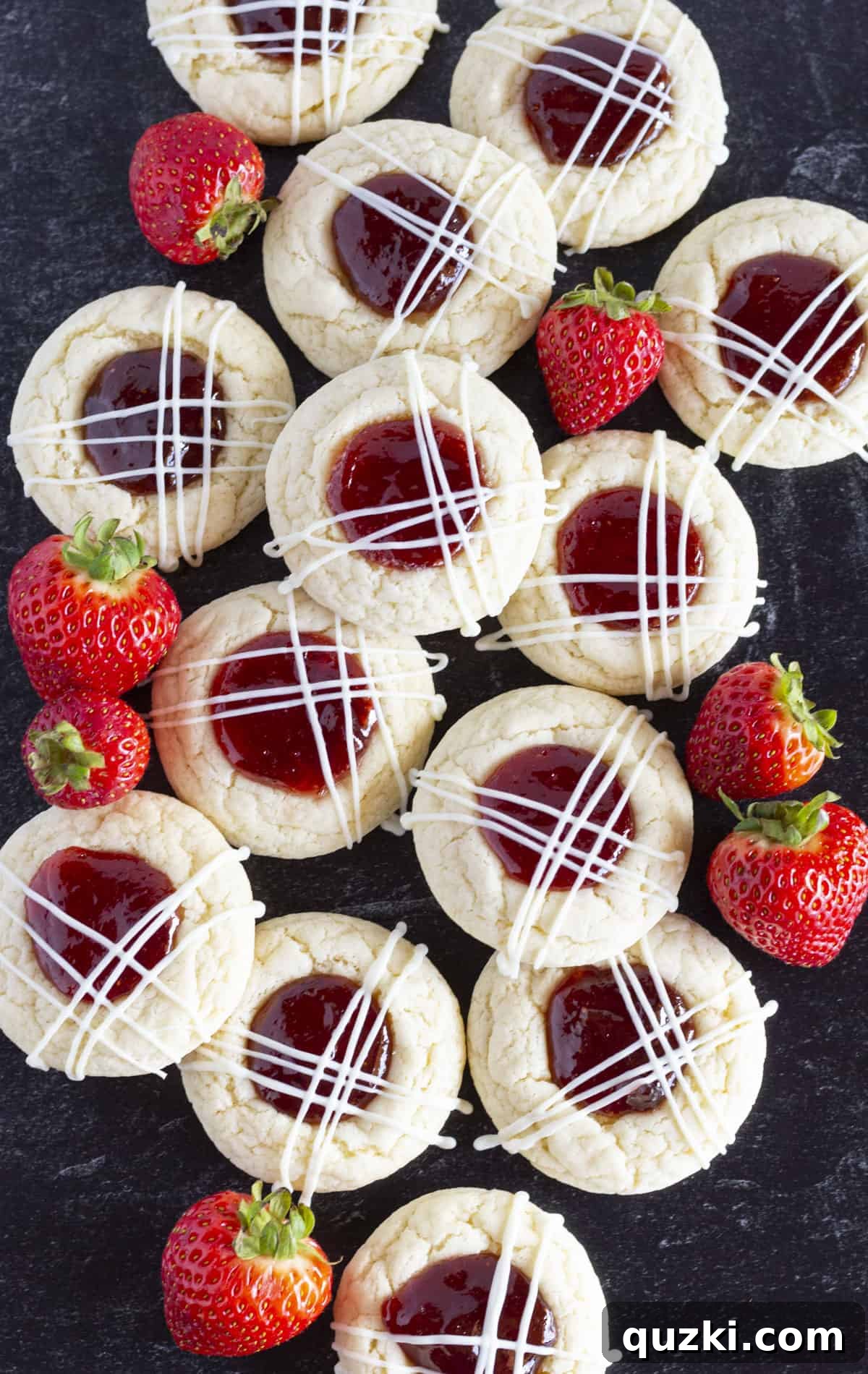 20 Festive Cake Mix Cookies Made Easy 22 A festive dozen of strawberry jam cookies, each with a dollop of red jam and a drizzle of white chocolate, garnished with fresh strawberries.