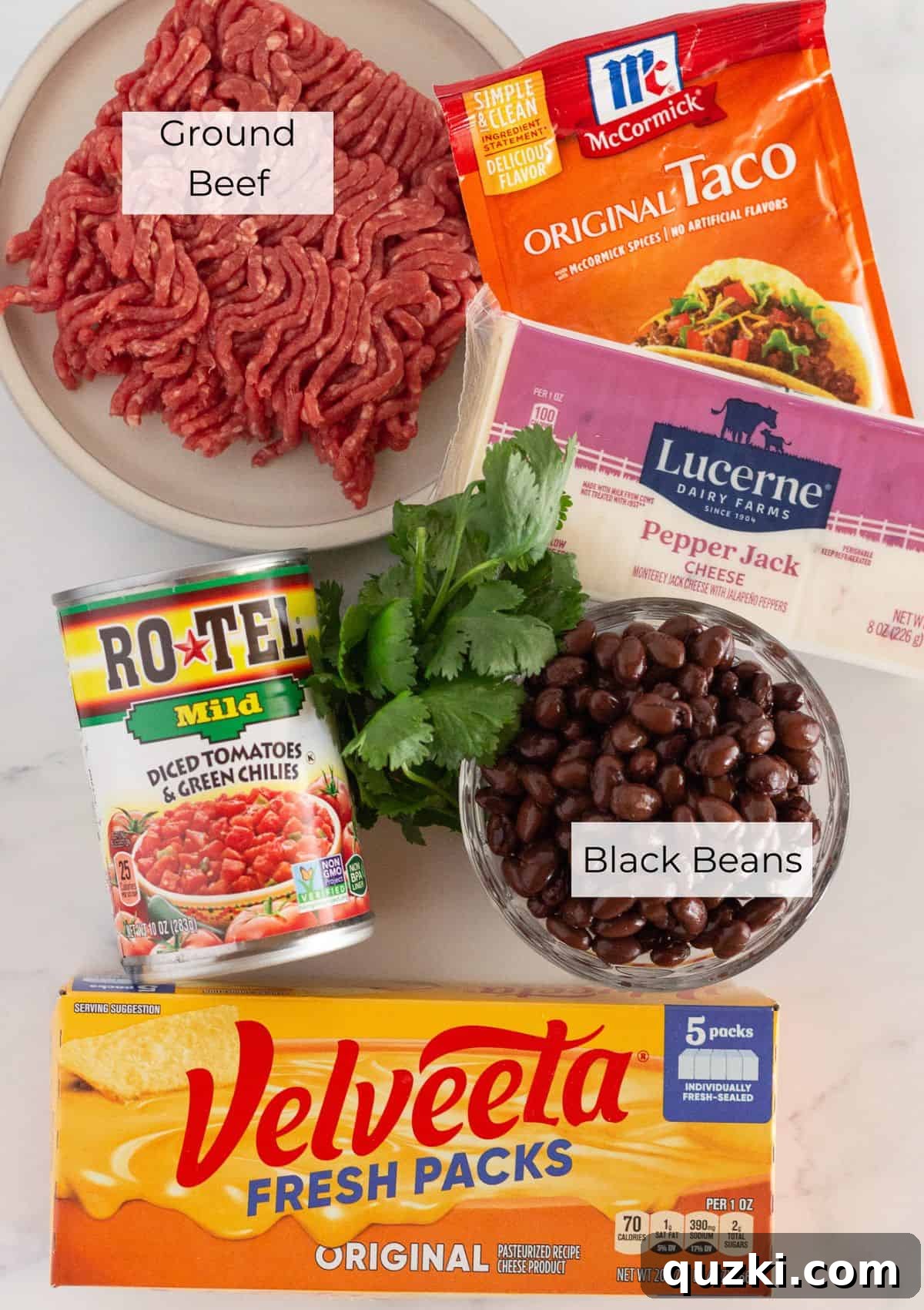 The ingredients needed to make Velveeta Queso with Rotel, laid out on a table.