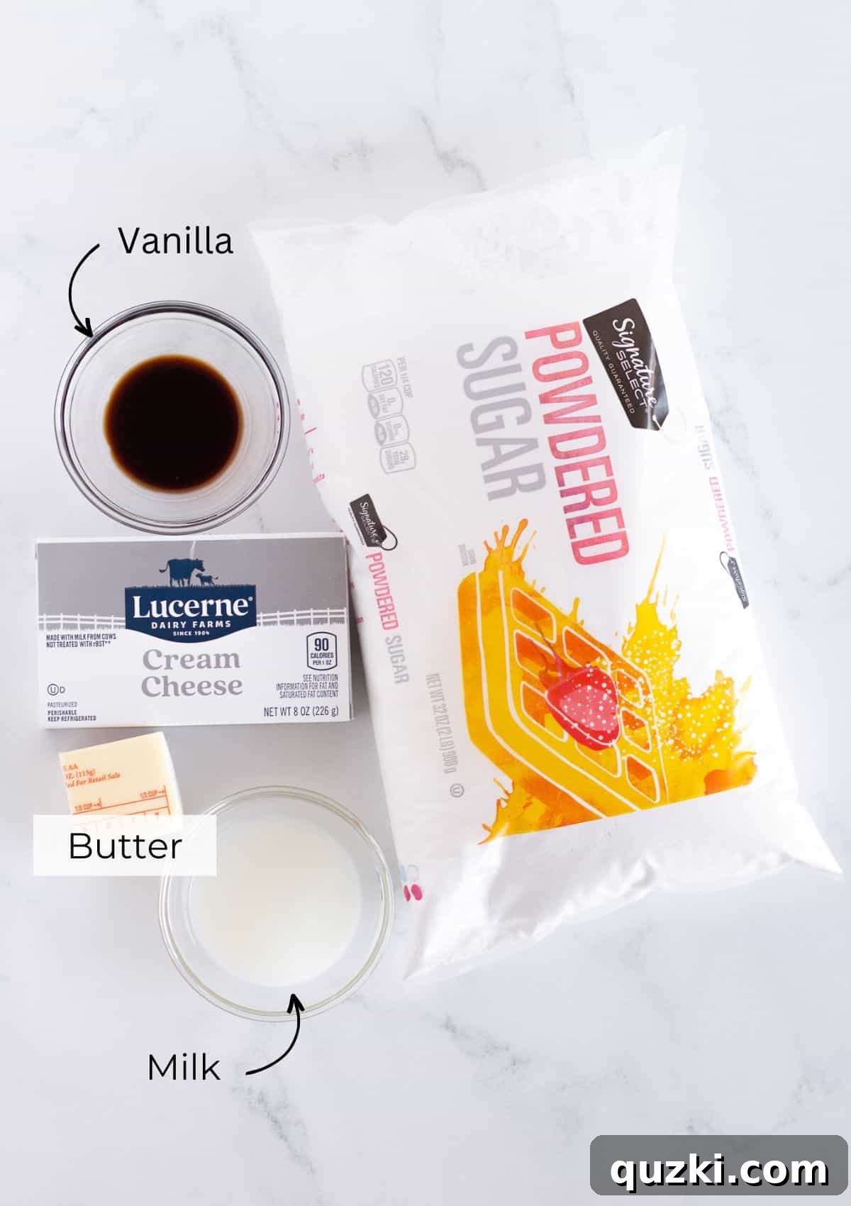 Cereal Milk Magic Frosting 3 A selection of the core ingredients laid out for making Cereal Milk Frosting, including heavy cream, a bowl of cereal, butter, and powdered sugar.