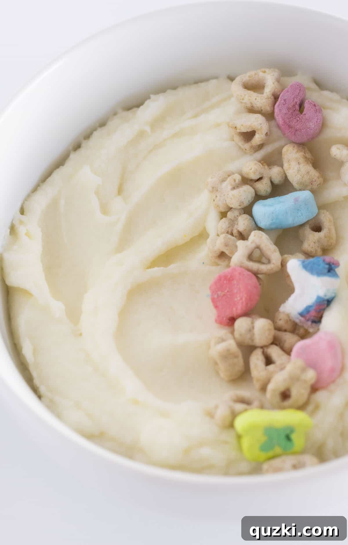 Cereal Milk Magic Frosting 5 A beautifully textured bowl of cereal milk frosting, garnished with a sprinkle of cereal on top, ready for use.