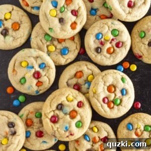 A dozen Mini M&M Cookies on a tray, highlighting their vibrant colors.