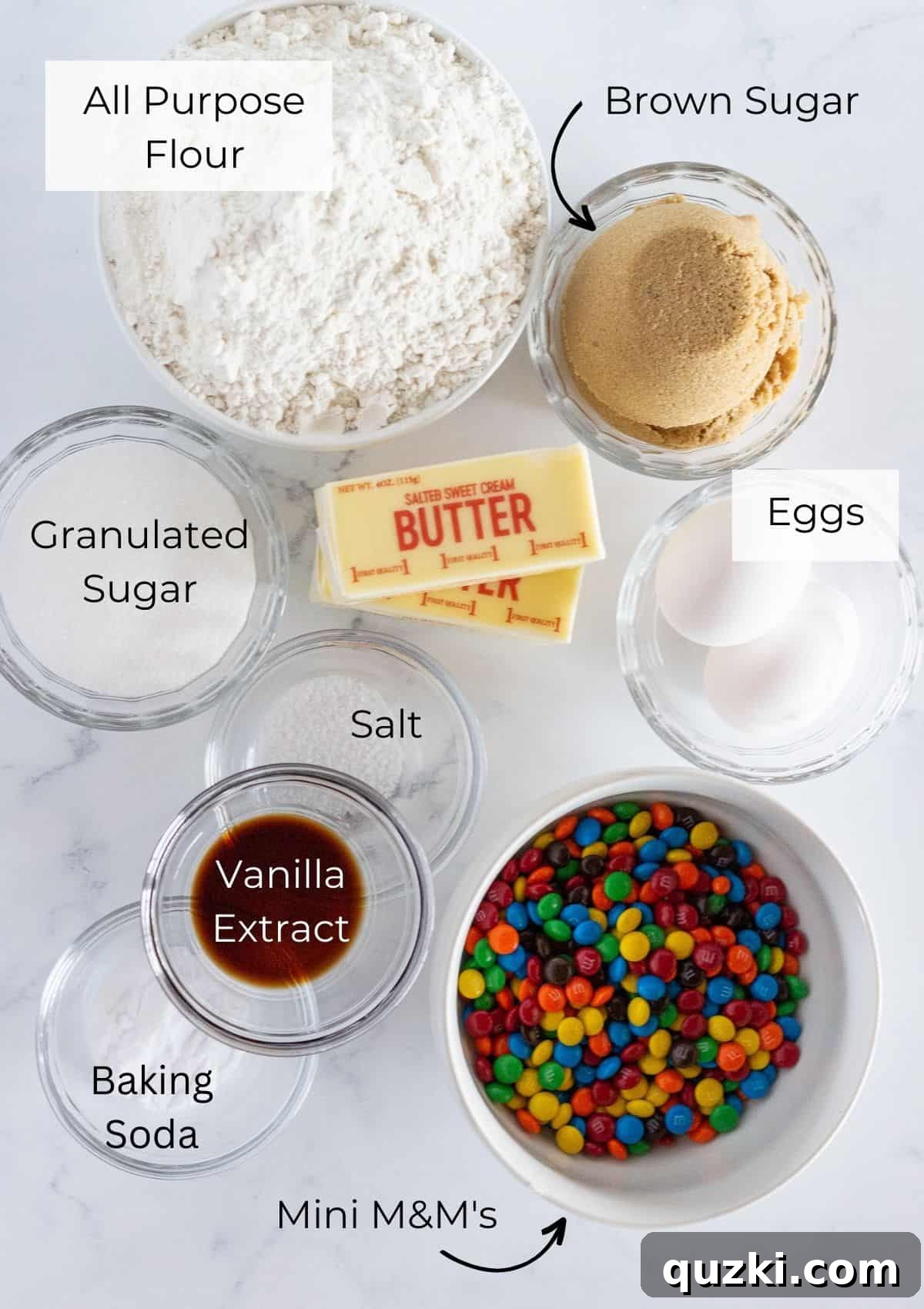 Irresistible Mini M&M Cookies 3 A flat lay of ingredients needed to make Mini M&M Cookies, including butter, sugars, flour, and M&M's.