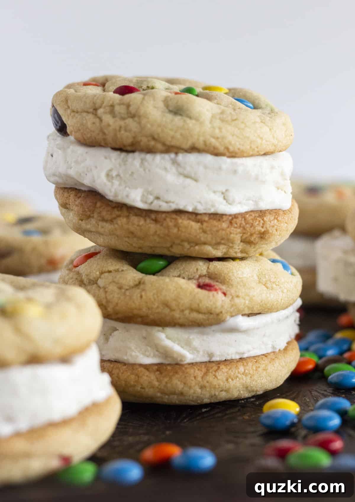 M&M Cookie Ice Cream Sandwiches From Scratch 2 Two vibrant M&M Ice Cream Sandwiches, beautifully stacked, showcasing their colorful candy shell and creamy filling.