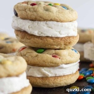 M&M Cookie Ice Cream Sandwiches From Scratch 8 M&M Ice Cream Sandwich cookies, stacked on a tray, showcasing their appealing colors and textures.