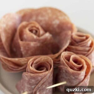 Two sizes of roses made with salami.