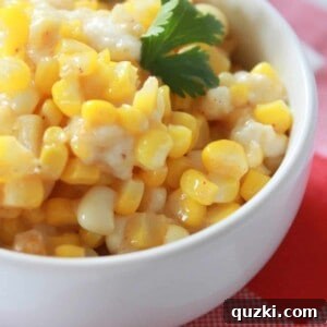 A close-up of the finished Mexican Street Corn Skillet, showcasing its creamy texture and fresh garnish.