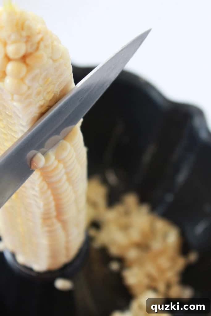 Visual guide to the Bundt pan corn cutting hack, showing a corn cob positioned in the pan's center.