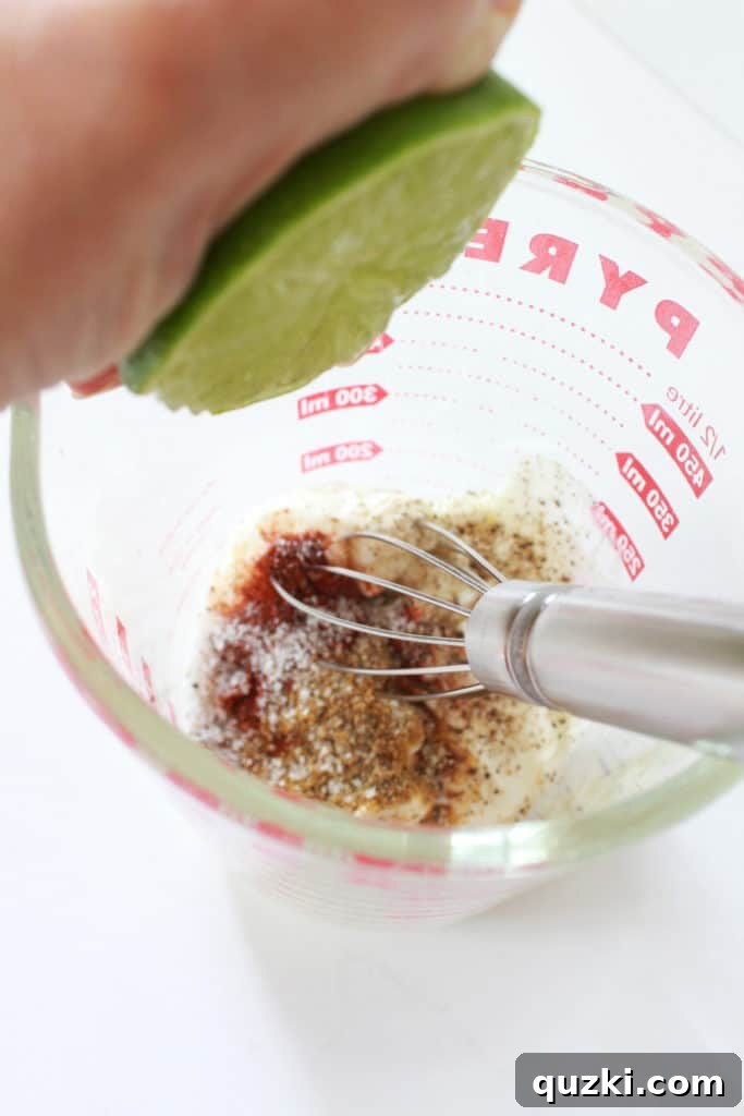 Gathering dressing ingredients for Mexican Street Corn, including mayonnaise, sour cream, and fresh lime.