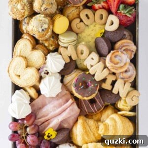 A beautifully arranged charcuterie board filled with various breakfast items, ready to be served.