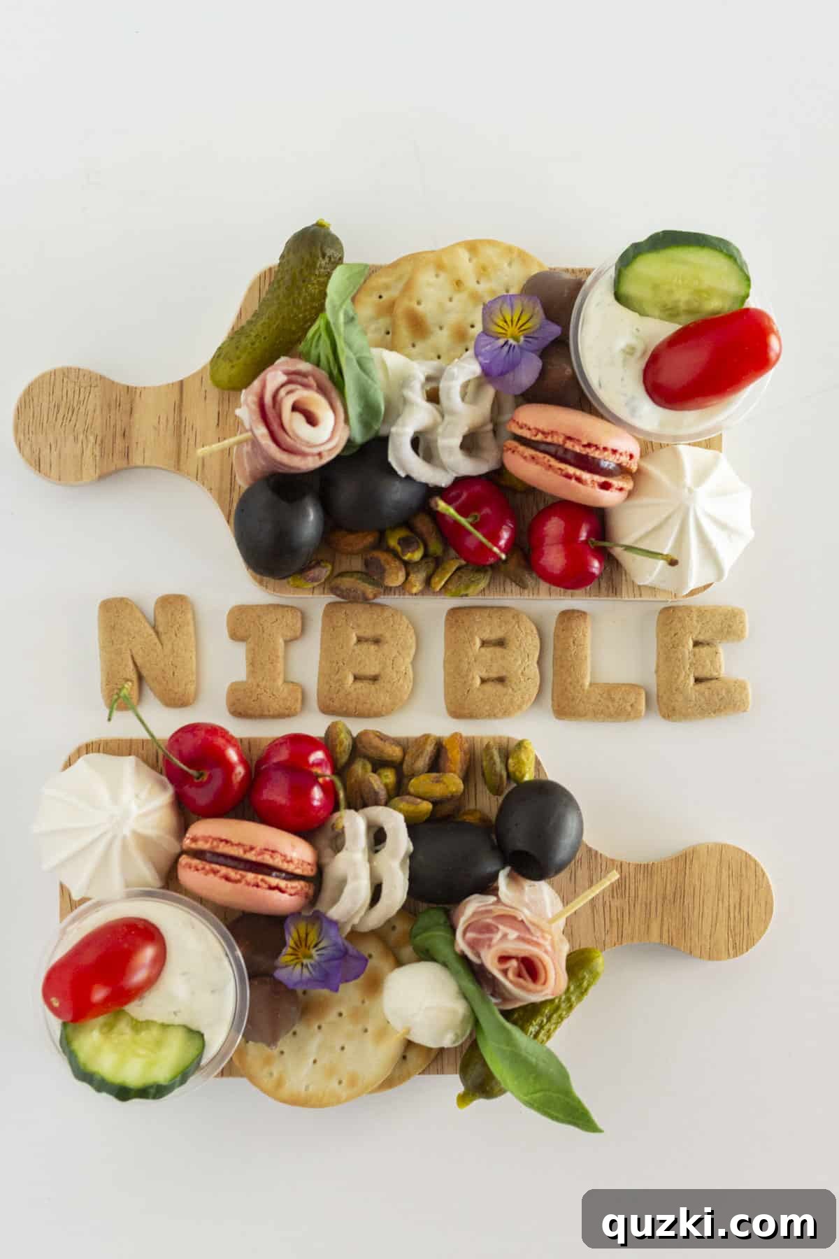 Build a Beautiful Personal Charcuterie Board 2 Two exquisitely arranged mini charcuterie boards, showcasing a vibrant array of meats, cheeses, fruits, and crackers.