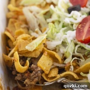 Serving a delicious walking taco casserole.