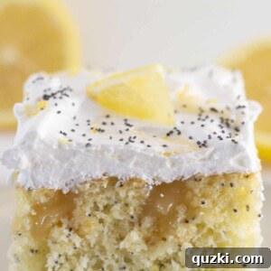 A square slice of the finished lemon curd cake on a white plate.