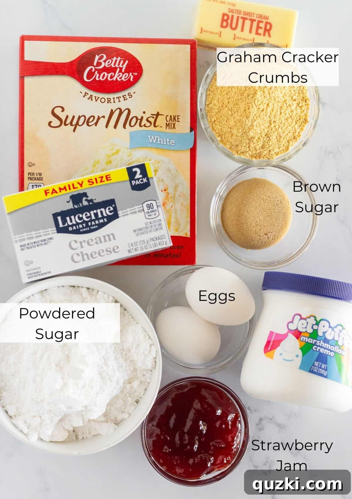Ingredients needed to make strawberry cheesecake cookies with a cake mix, including a box of vanilla cake mix, graham cracker crumbs, cream cheese, marshmallow fluff, and strawberry jam.