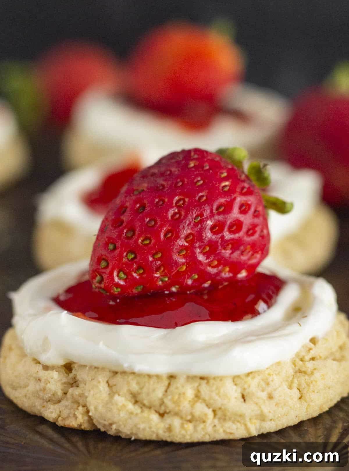 A large batch of Strawberry Cheesecake Cookies cooling on a baking sheet, showcasing their uniform shape and inviting appearance.