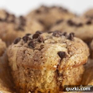 A Nutella swirled muffin with the wrapper off and ready to eat, highlighting its perfect texture.