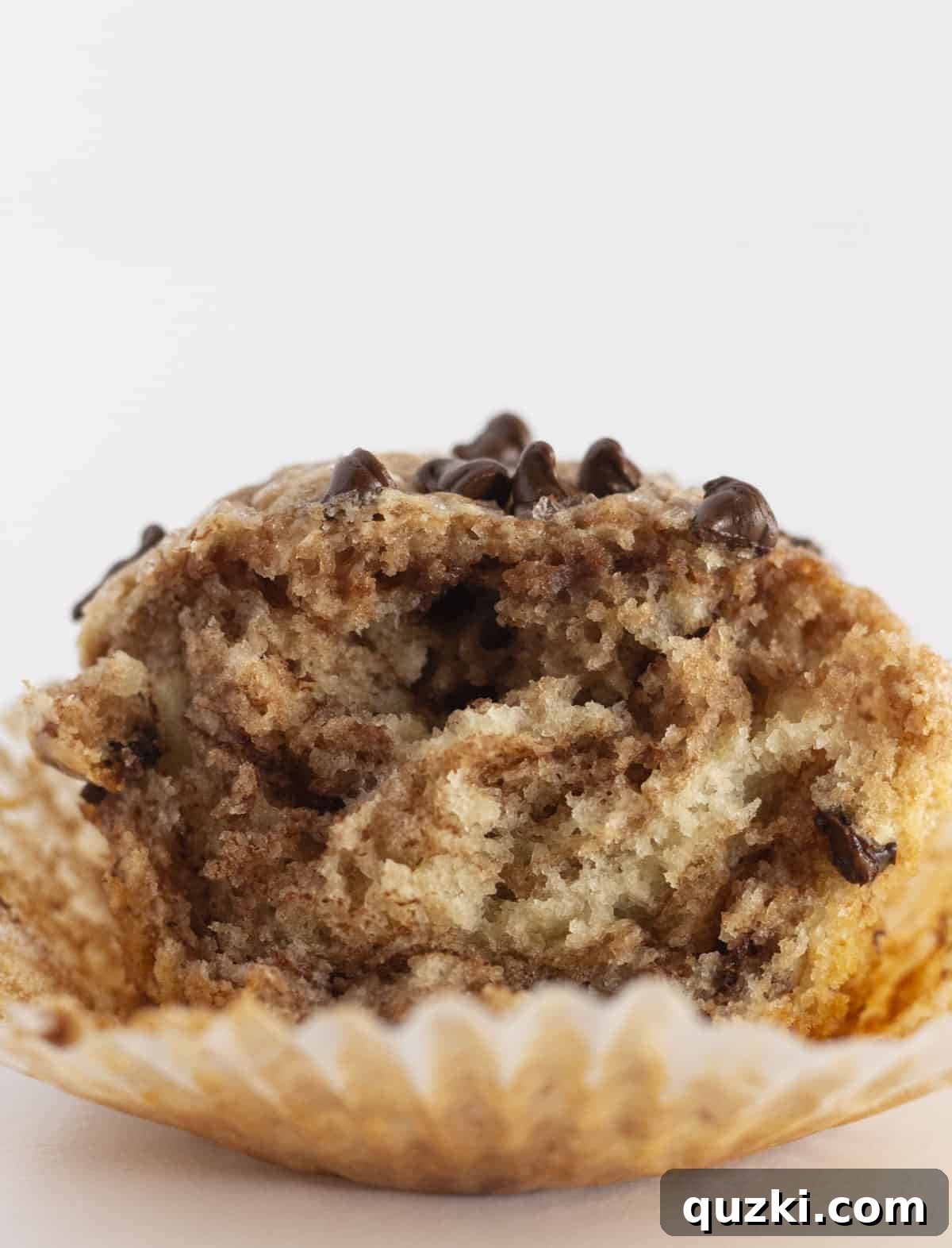 A close-up view looking into the middle of a Nutella Swirled Muffin, clearly showing the beautiful hazelnut swirls.