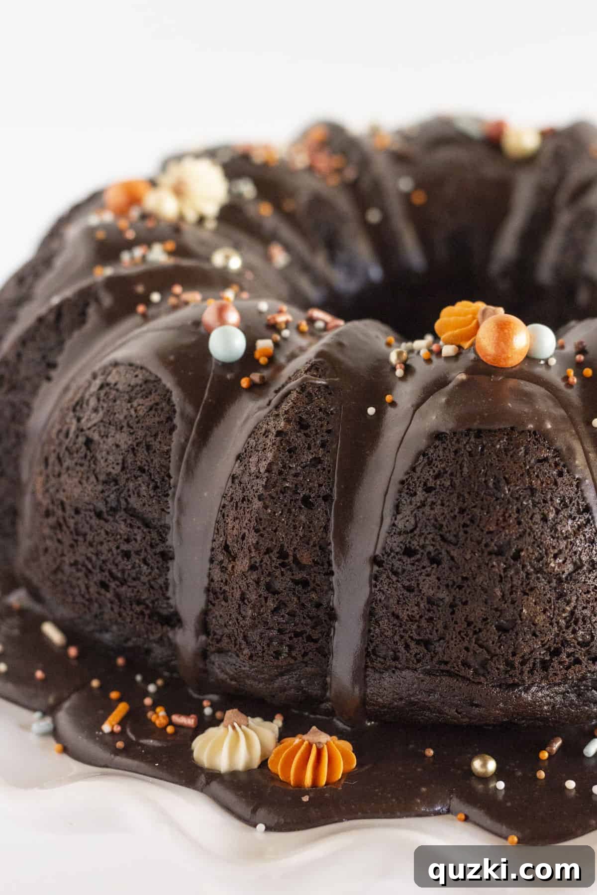 A finished black velvet cake with festive sprinkles, perfect for any celebration.