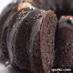 A black velvet cake made with a cake mix with a piece being cut & served.