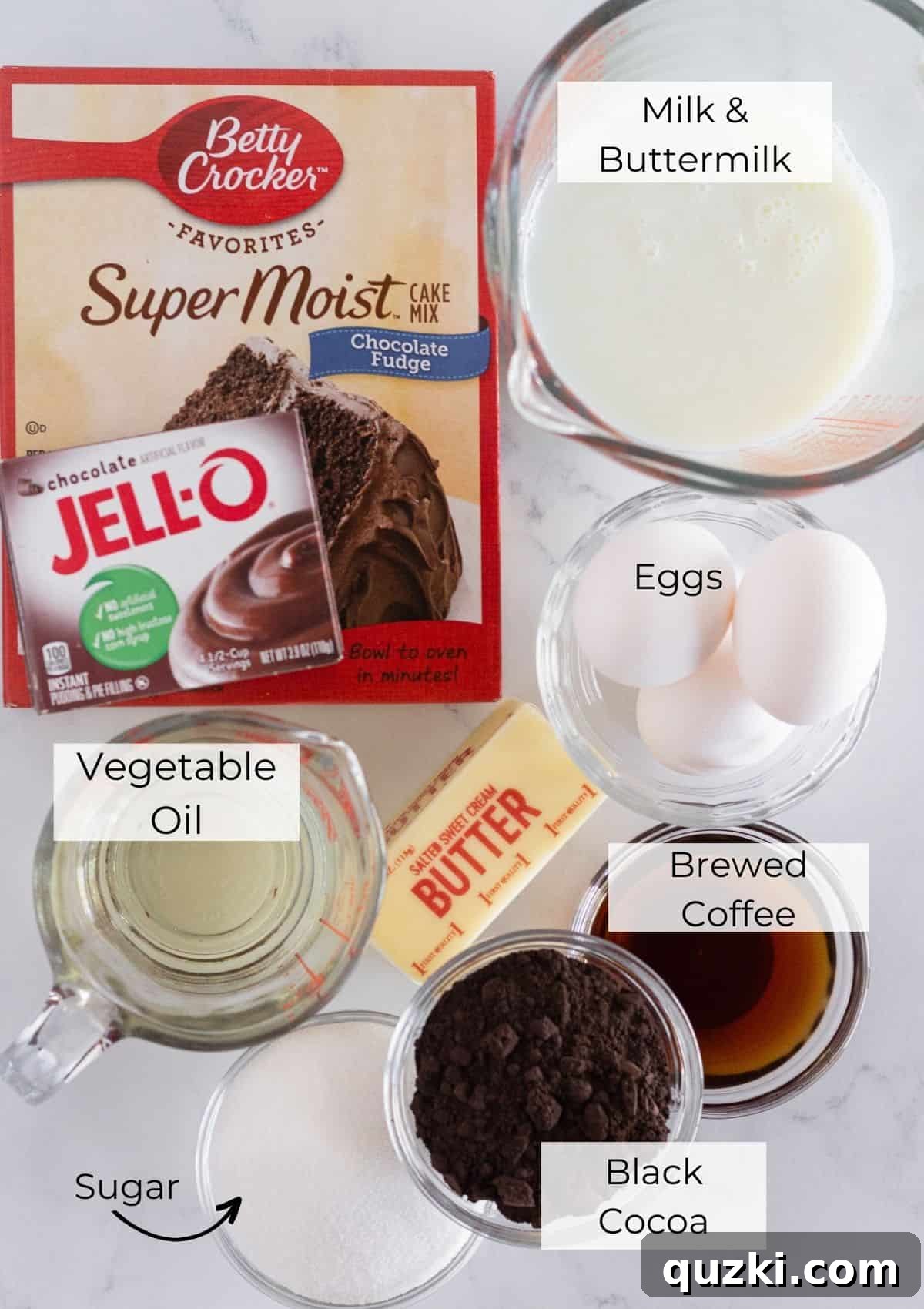 The ingredients needed to make a Black Velvet Cake, neatly arranged on a counter.