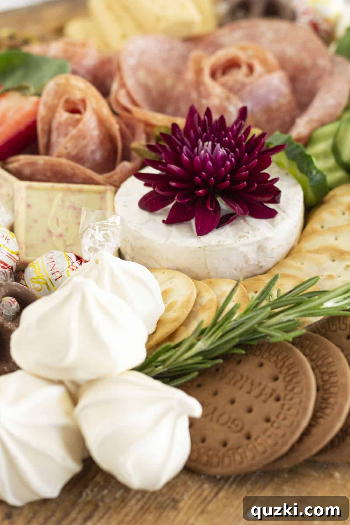 Crafting the Ultimate Christmas Charcuterie Board 3 A close-up shot of a Christmas Charcuterie Board featuring an abundance of festive ingredients.