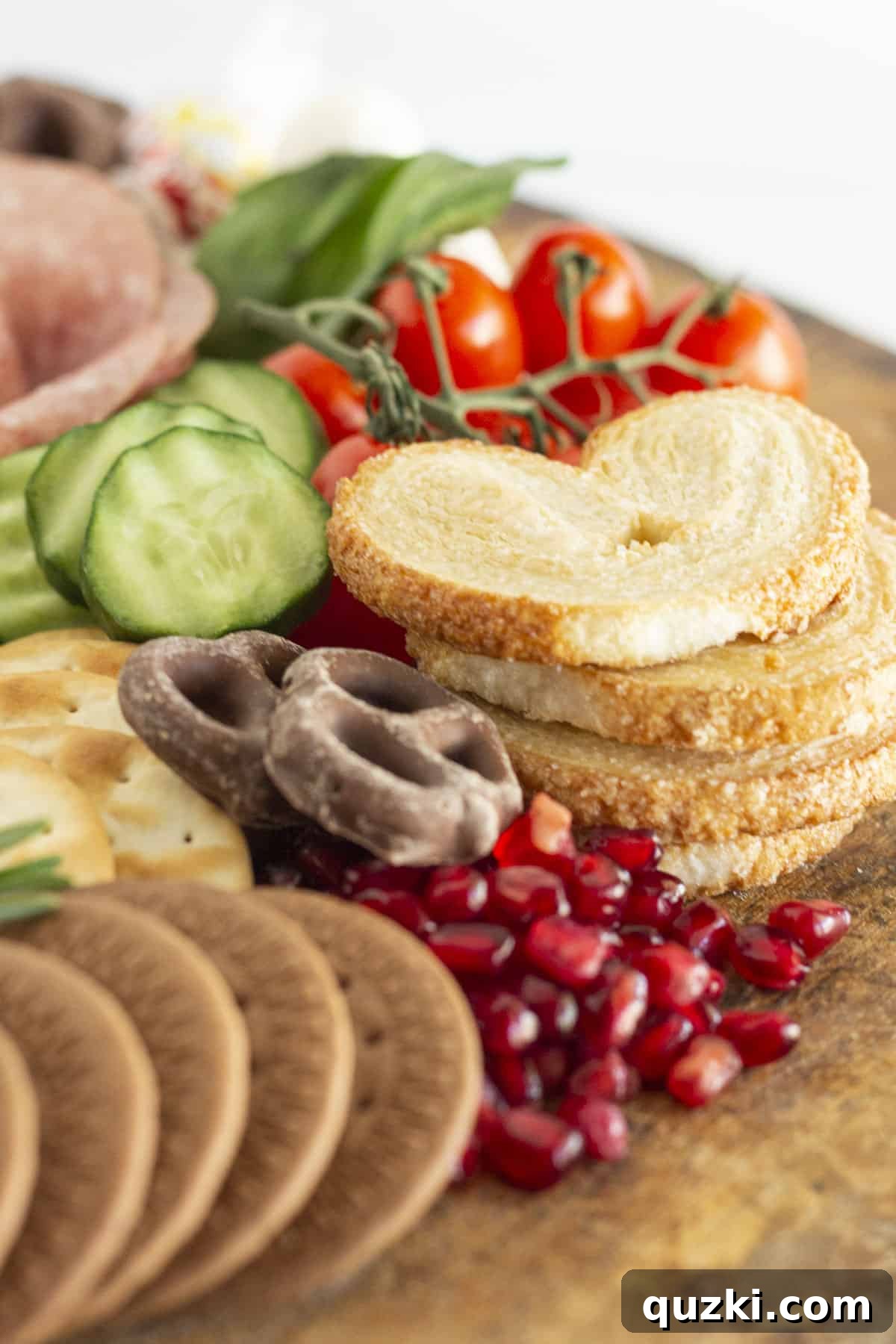 Crafting the Ultimate Christmas Charcuterie Board 4 A close up of a charcuterie board made for Christmas, highlighting the variety and festive colors.