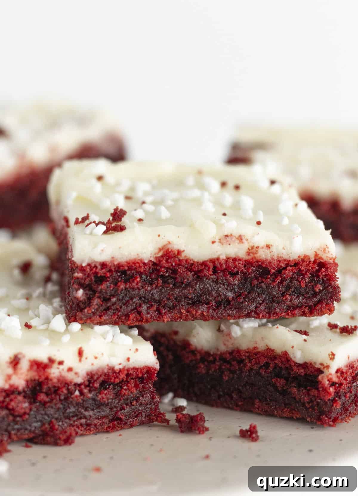Finished red velvet brownies with cream cheese frosting.