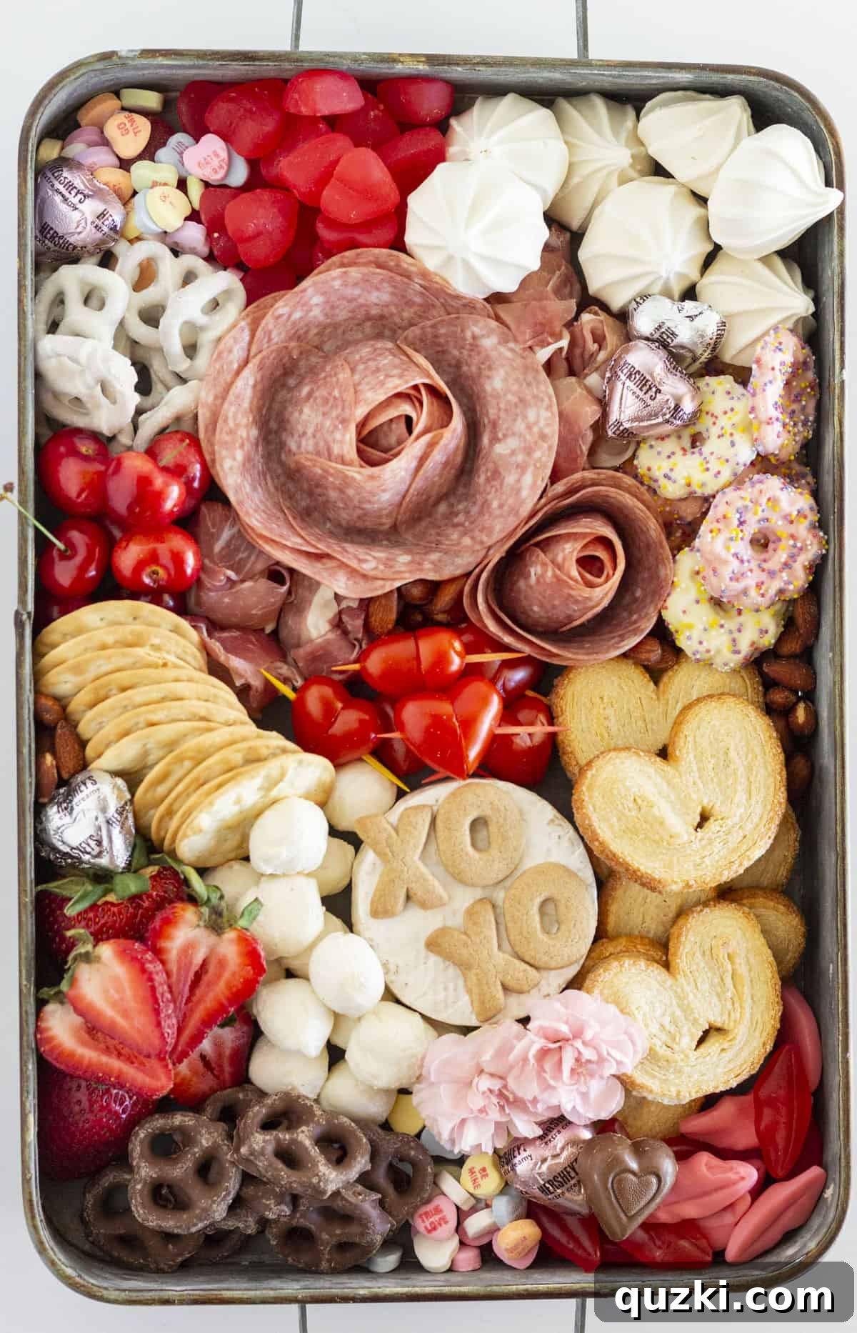 Sweetheart Charcuterie: The Perfect Valentine's Day Indulgence 2 A stunning Valentine's Day Charcuterie Board adorned with red and pink foods, heart-shaped items, and various gourmet treats.