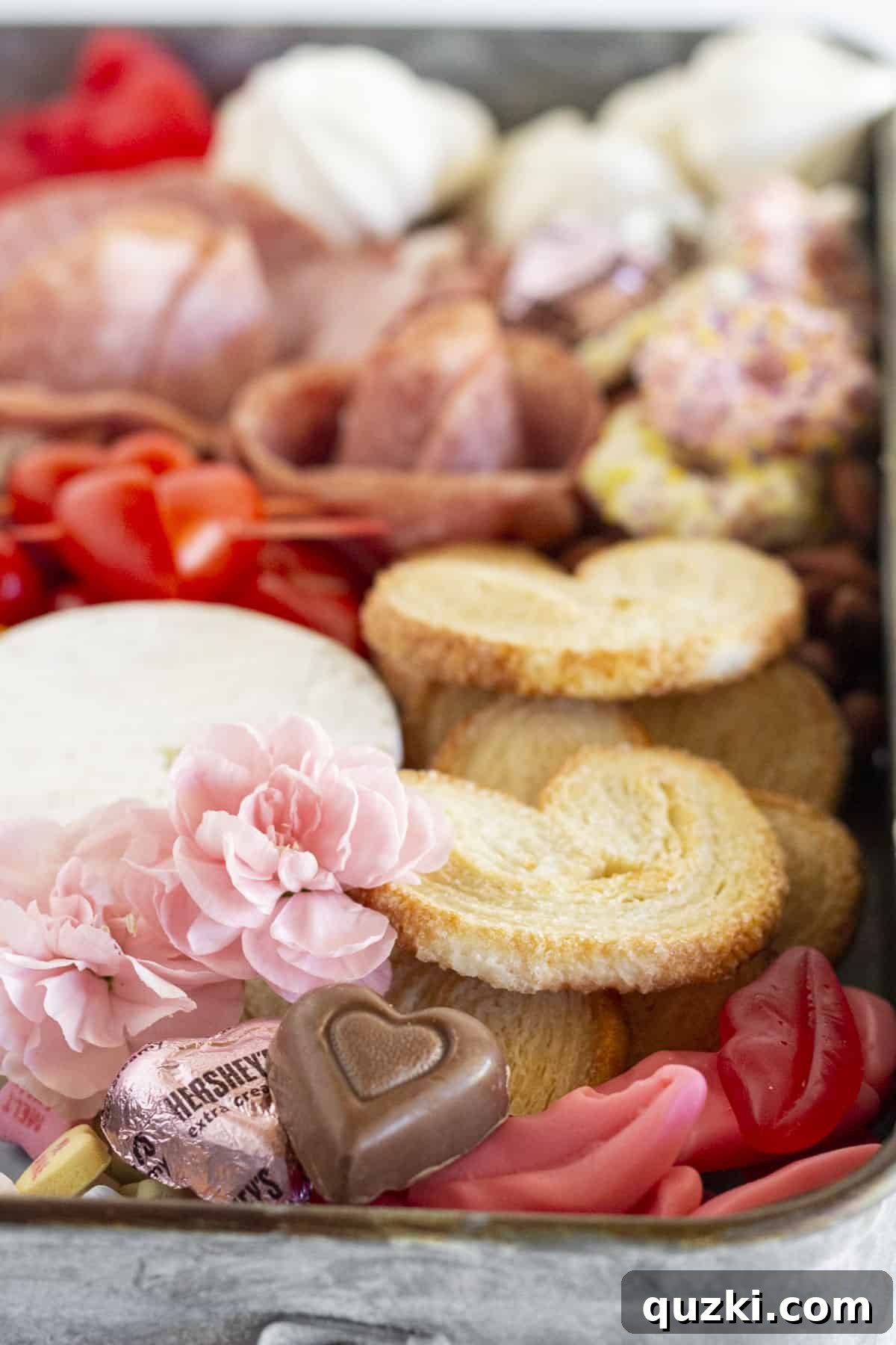 Sweetheart Charcuterie: The Perfect Valentine's Day Indulgence 4 A beautifully decorated Valentine's Day Charcuterie Board, showcasing intricate details and fresh garnishes.