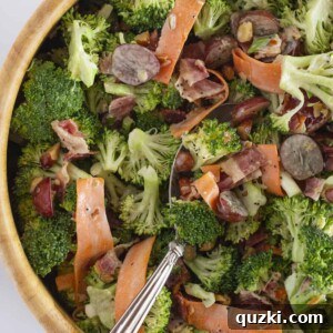 A wooden salad bowl full of broccoli crunch salad, showcasing the vibrant colors and appealing texture.