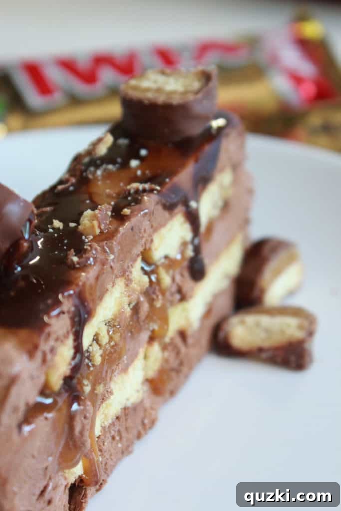 A close-up shot of a perfect slice of Twix Icebox Cake being carefully cut with a serrated knife, highlighting the beautiful and distinct layers of chocolate, shortbread, and caramel within.