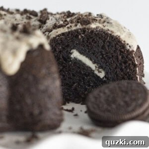 A delicious cross-section of the Easy Oreo Bundt Cake recipe, highlighting its moist chocolate texture and cookie chunks.