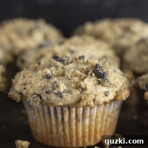 Crumbly Cream Dream Muffins 8 Serving Oreo Muffins on a dark platter.