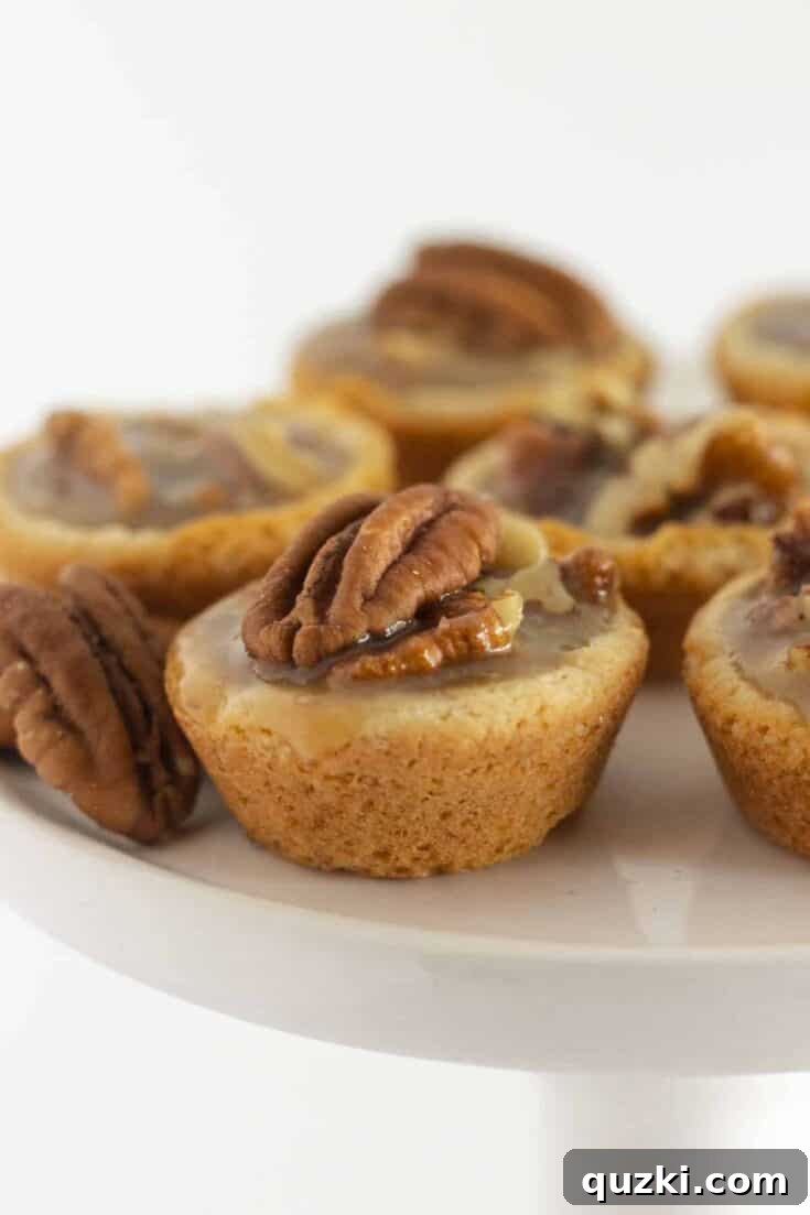 Easy Pecan Pie Cookies, golden cookies with a gooey pecan topping.