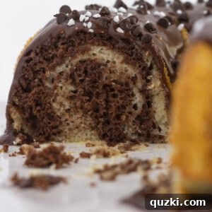 Looking into the middle of a chocolate and vanilla marble cake, showcasing the beautiful swirls.