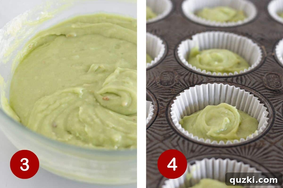 Pudding Mix Perfection: Effortless Pistachio Muffins 5 A large bowl of green pistachio muffin batter, with a cookie scoop filling paper-lined muffin cups in a baking tin.