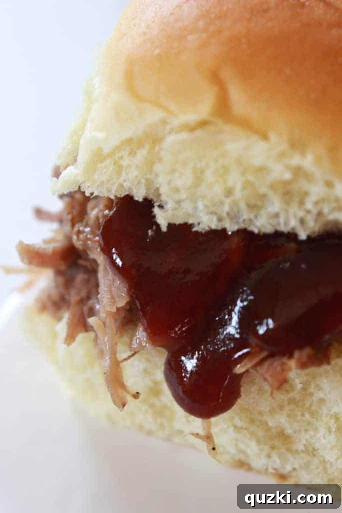 Crock Pot Pulled Pork Recipe featured by top US food blog, Practically Homemade
